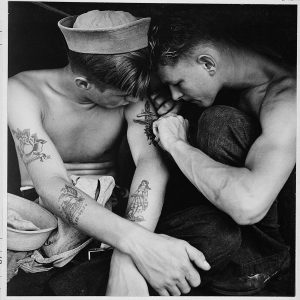 US Sailors getting tattooed on board a ship