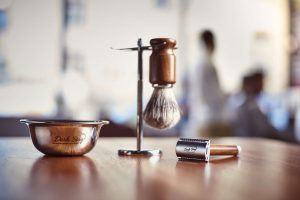 The Dark Stag Shaving Set artistically displayed in a barbershop