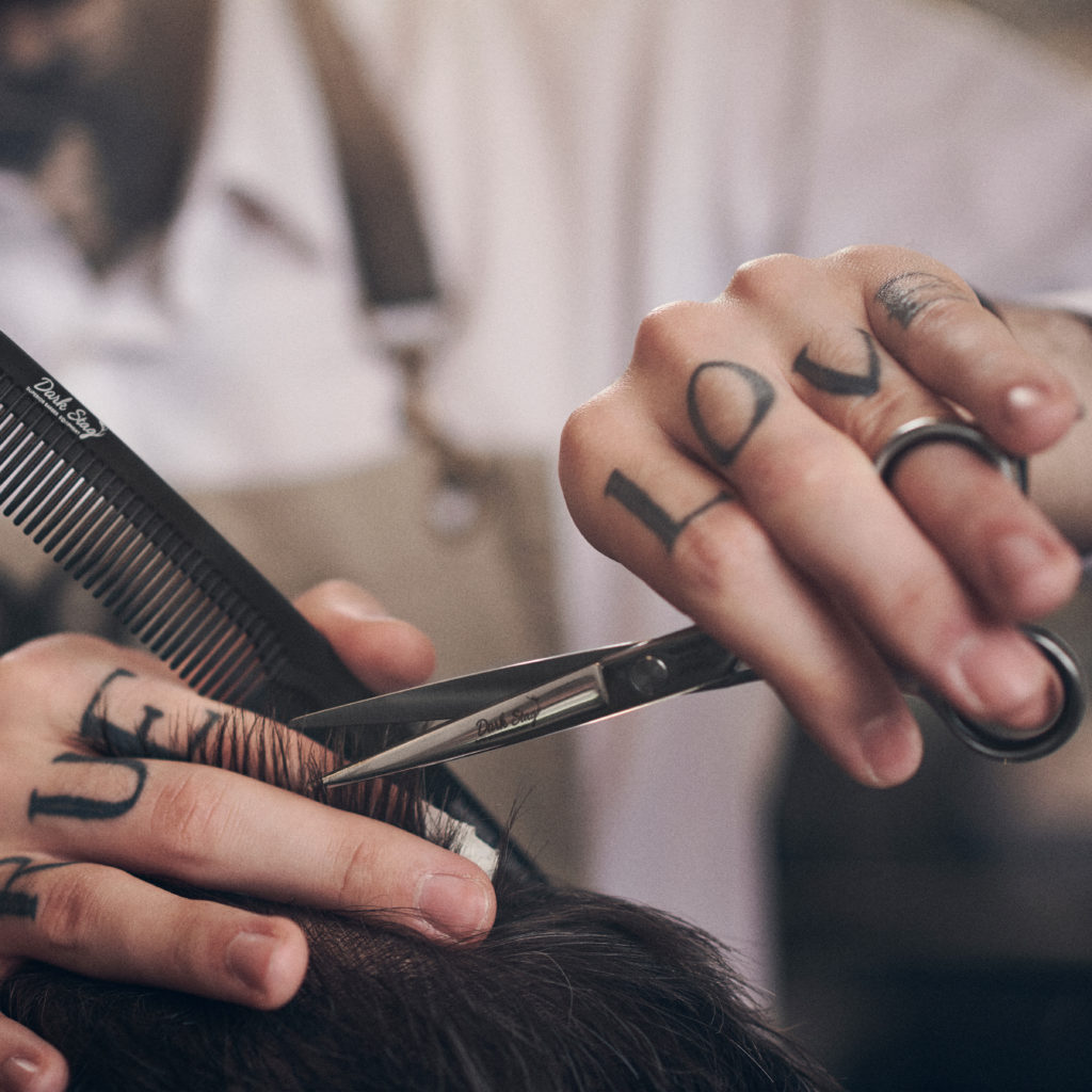 how to hold a barbering scissor